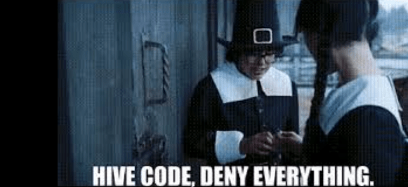 Image: screenshot of a GIF of Eugene and Wednesday from Tim Burton's 2022 series, standing outside a barn door, dressed in pilgrim outfits - text at bottom reads "Hive code, deny everything"